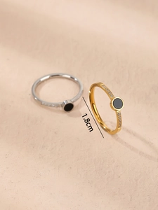 Detail shot of Roman numeral rings in gold and silver finish with crystal pavé and 1.8cm diameter