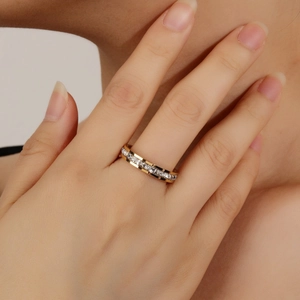 Elegant gold-plated eternity ring with sparkling cubic zirconia on a female hand