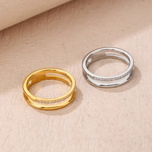 Macro view of double-layered rings with micro-inlaid cubic zirconia in gold and silver