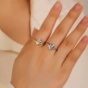 Elegant gold and silver V-shaped wishbone rings with pear-cut cubic zirconia stones