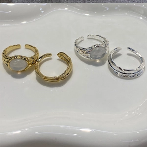 Set of 4 vintage feather rings with moonstone in gold and silver plated brass