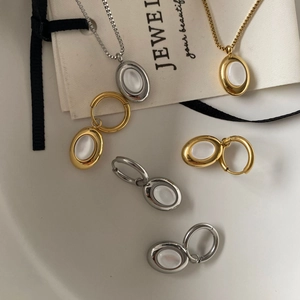 Detailed set of 18K gold and silver plated necklaces and earrings with white oval shells