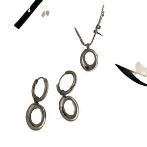 Minimalist silver oval necklace and earrings set in polished stainless steel for women