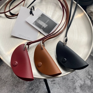 Chic semi-circular leather pendant bags in burgundy, brown and black with metal rings