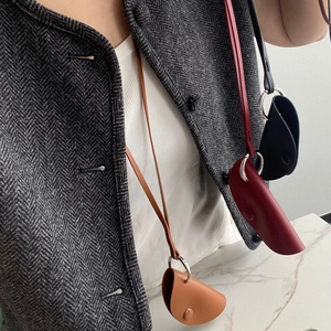 Minimalist leather neck pouch necklace for keys and earphones in three classic colors