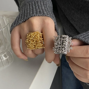 Modern gold and silver fireworks seed ball rings with bold artistic statement style