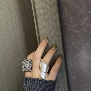 Statement silver rings with fireworks-seed texture and brushed spiral punk design