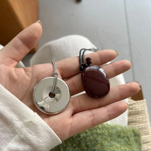 Minimalist silver circle pendant and reddish brown pebble necklace set for women