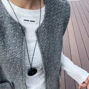 Minimalist black obsidian Pingan Kou pendant necklace on a long black cord cord