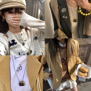 Detailed views of mini handbag pendant necklace styled on various fashion outfits