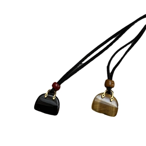 Minimalist bag-shaped natural stone necklaces with tiger eye and obsidian pendants