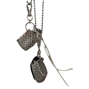 Silver woven metal mini bag pendant with long chain necklace for versatile styling