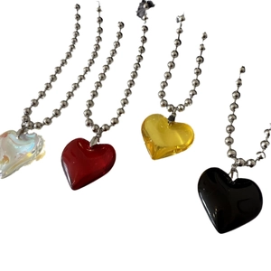 Colorful heart pendants with silver ball chains in clear, red, yellow and black tones