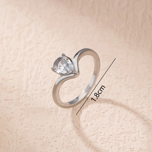 Silver curved ring with pear-shaped cubic zirconia and 1.8cm diameter measurement