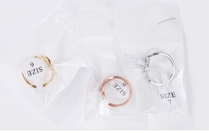 Detailed set of three rings in gold, rose gold, and silver finishes with zirconia stones
