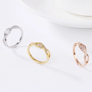 Elegant heart-shaped zircon rings in silver, gold, and rose gold with twisted bands