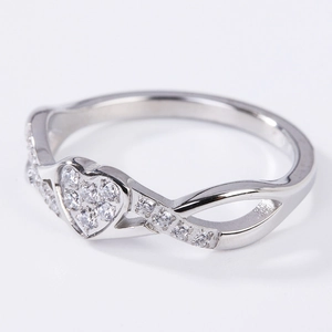 Crossed silver heart ring with sparkling zircons and infinity band design for women