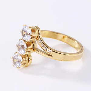 Elegant rose gold three-stone vertical ring with cubic zirconia and micro-pave accents