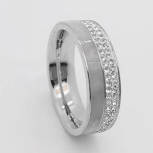 Minimalist silver-colored metal ring featuring half-smooth and half-sparkling zircon stones