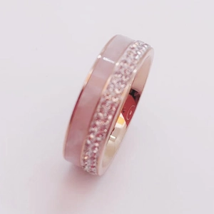 Rose gold layered ring with pink enamel inlay and pave-set cubic zirconia stones