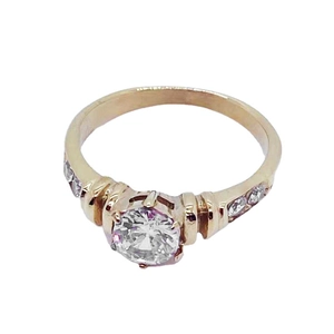 Classic rose gold plated women's ring with a large round diamond-cut center stone and pave zircons