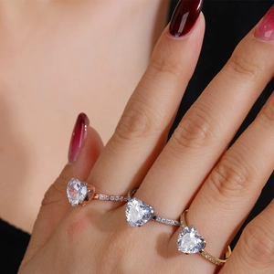 Elegant heart-shaped diamond ring in rose gold and silver finish with pavé set band