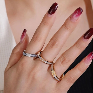 Minimalist mother of pearl and zircon stacked rings in gold, silver, and rose gold finish