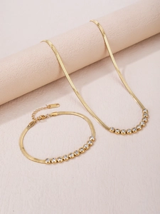 Flat gold snake chain necklace and bracelet set with gradient pavé zircon accents