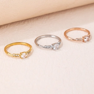 Three minimalist slim stackable rings in gold, silver, and rose gold with zircon stones