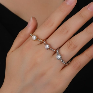 Three-piece stackable ring set with cubic zirconia in gold, silver, and rose gold finish