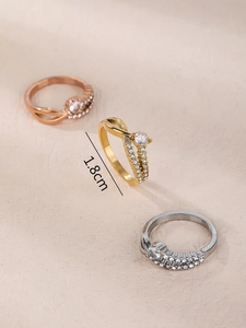Detailed close-up showing 1.8cm inner diameter measurement of gold cross design rings