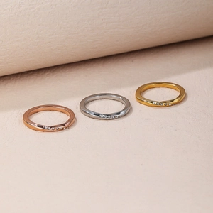Detailed macro of tri-color Mobius twist rings with zircon pave in gold and silver