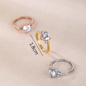 Three-piece heart-shaped ring set in gold, silver and rose gold with clear zircon stones