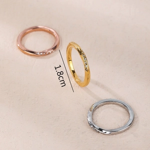 Three-piece set of Mobius twist rings in gold, rose gold, and silver with zircon accents