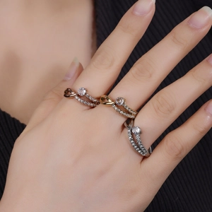 Crossed line ring set with pavé cubic zirconia in rose gold, gold, and silver finishes