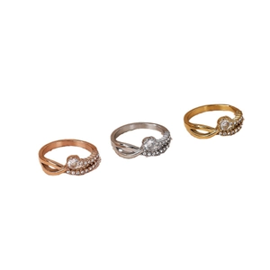 Three-piece set of twisted rings in rose gold, silver, and gold with sparkling crystals