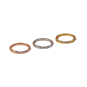 Three-piece set of Mobius twist rings in gold, silver, and rose gold with zircon accents