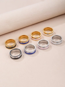 Detail of minimalist ceramic stainless steel rings with square cubic zirconia inlays