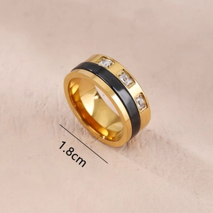 Gold stainless steel ring with black enamel band and three rectangular zircons