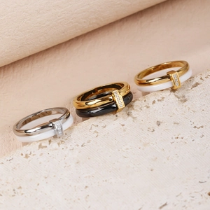 Polished ceramic and stainless steel interlaced rings with cubic zirconia inlay details
