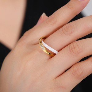 Double-layered interlocking ring with gold stainless steel, white ceramic and zircon accents