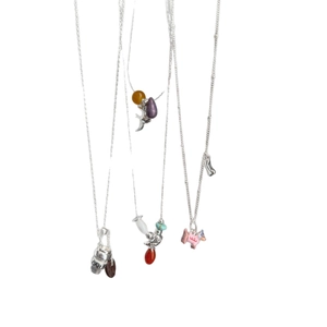 Modern silver necklaces featuring coffee bean, bird, and pink dog pendants with colorful beads