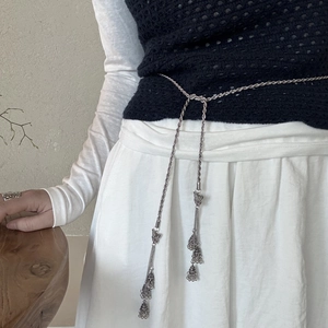Silver boho waist chain with double braided links and vintage tassel bell pendants
