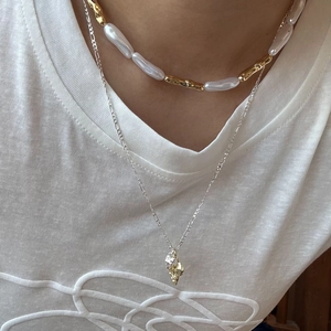 Two-layer mixed metal heart necklace with baroque pearls and gold silver pendant