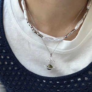 Baroque pearl layered necklace with silver metal tube and dark green planet pendant