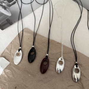 Minimalist silver long sweater necklace with hollow oval teardrop pendant and leather cord