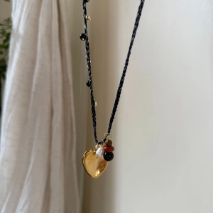 Bohemian woven necklace with golden heart pendant and mixed natural stone bead accents