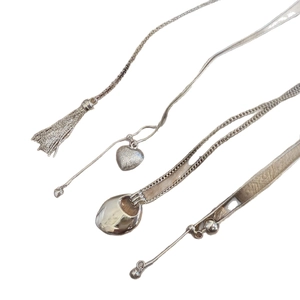 Silver brushed heart pendant necklace with metal tassels and woven style accessories
