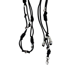 Minimalist black braided waist chain with white beads and silver diamond-shaped metal charms