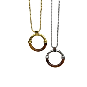 Minimalist stainless steel necklaces with amber tortoiseshell pendants in gold and silver